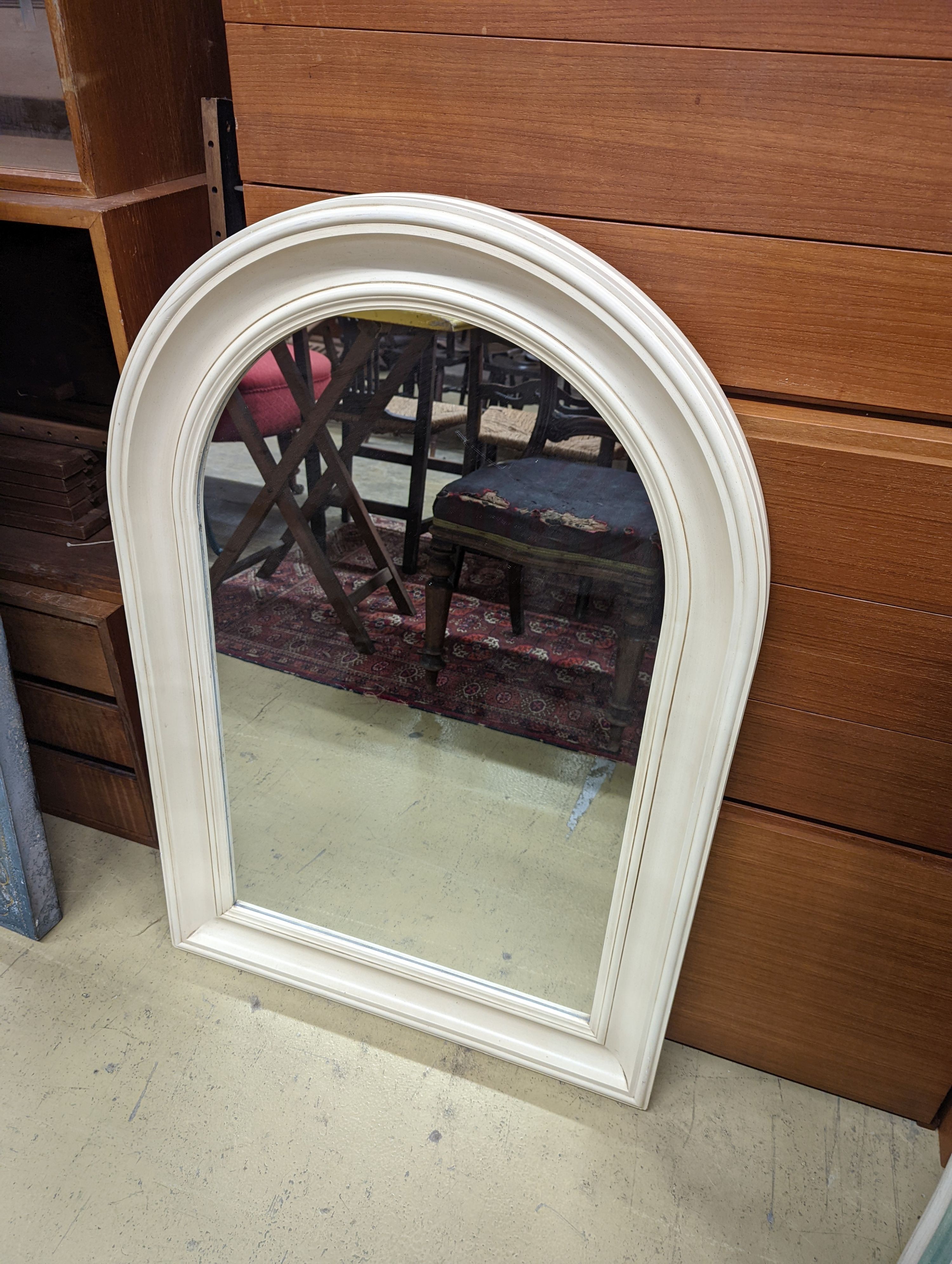 Two modern cream painted wall mirrors, larger width 69cm, height 106cm